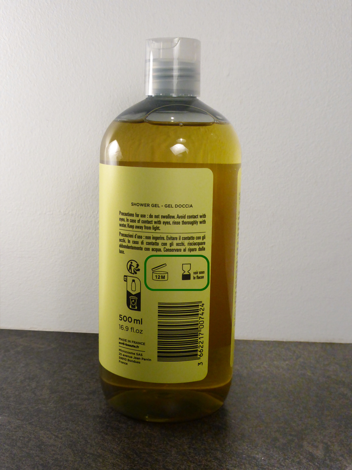 A shower gel bottle with the pictograms visible in the middle of the label